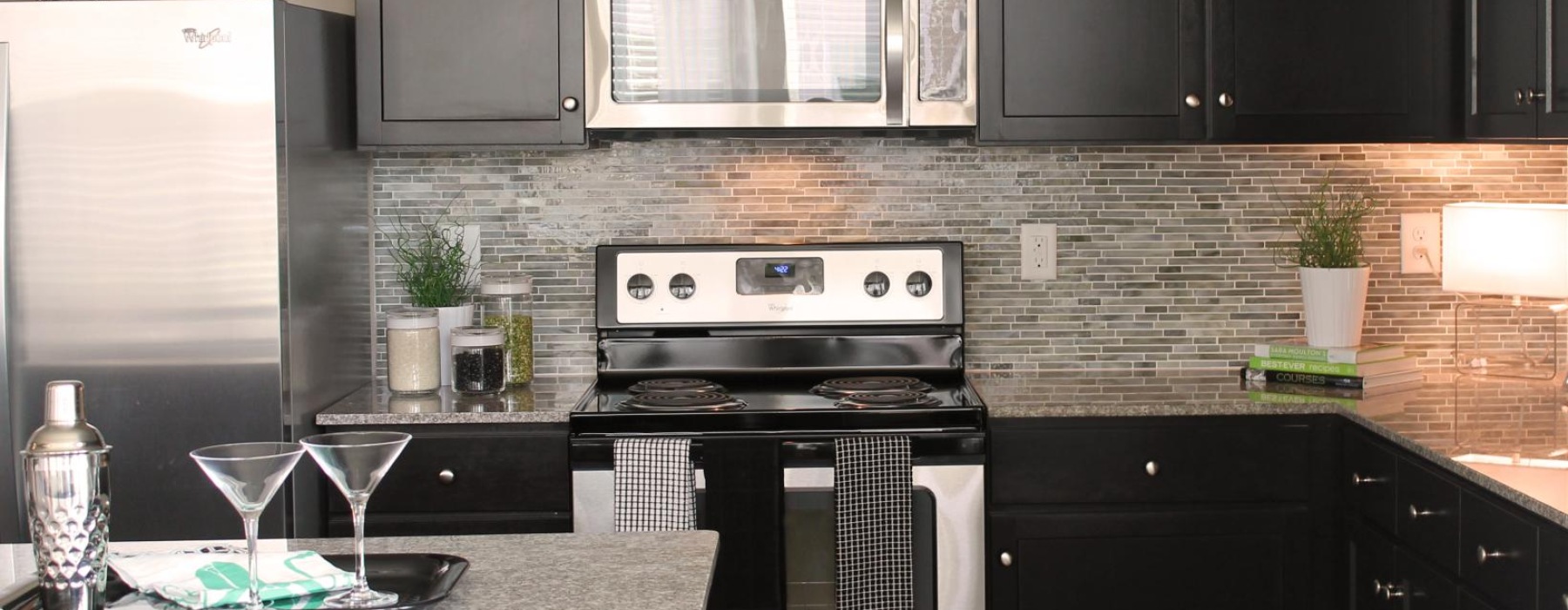 a kitchen with black cabinets