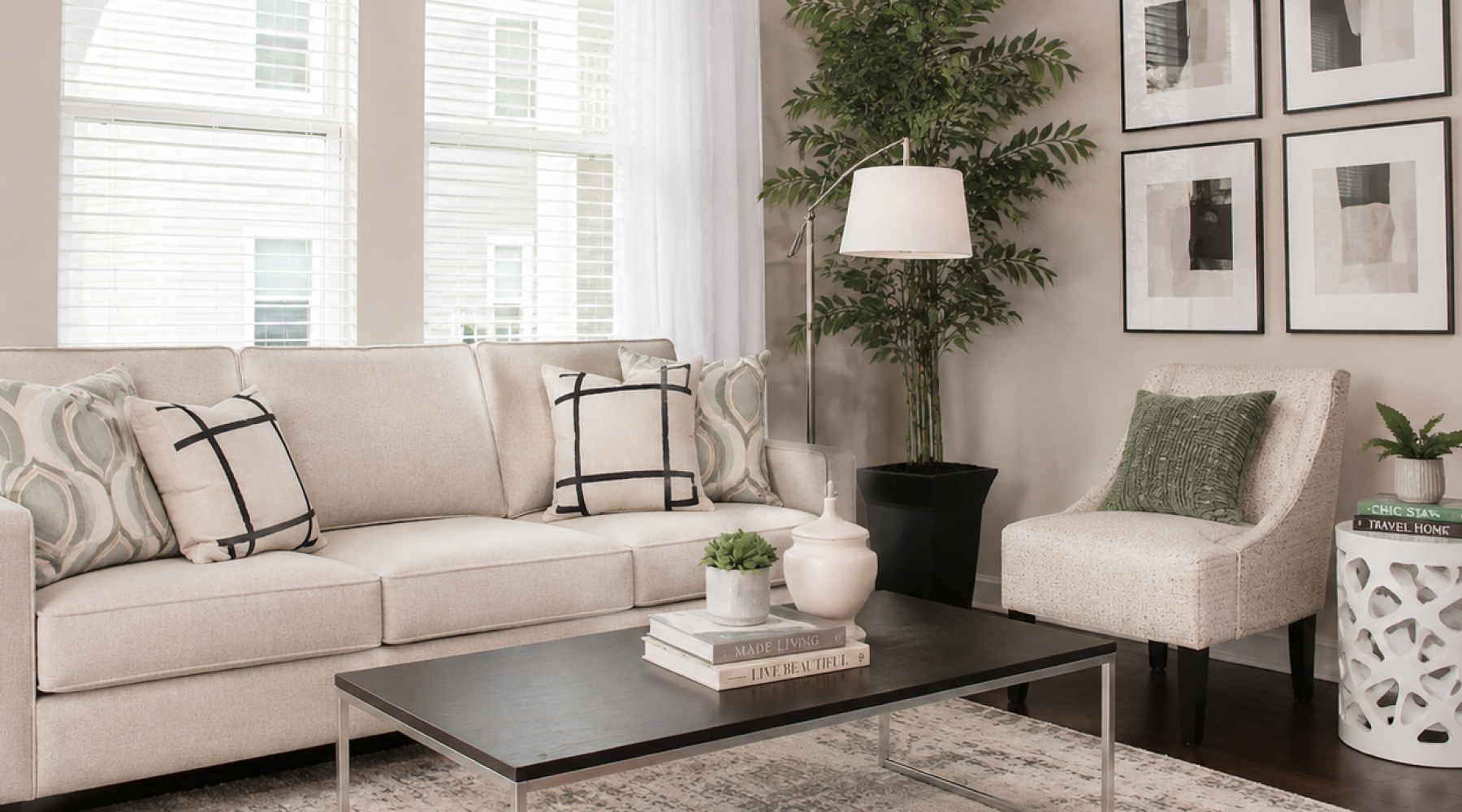 a couch with a table and potted plants on it