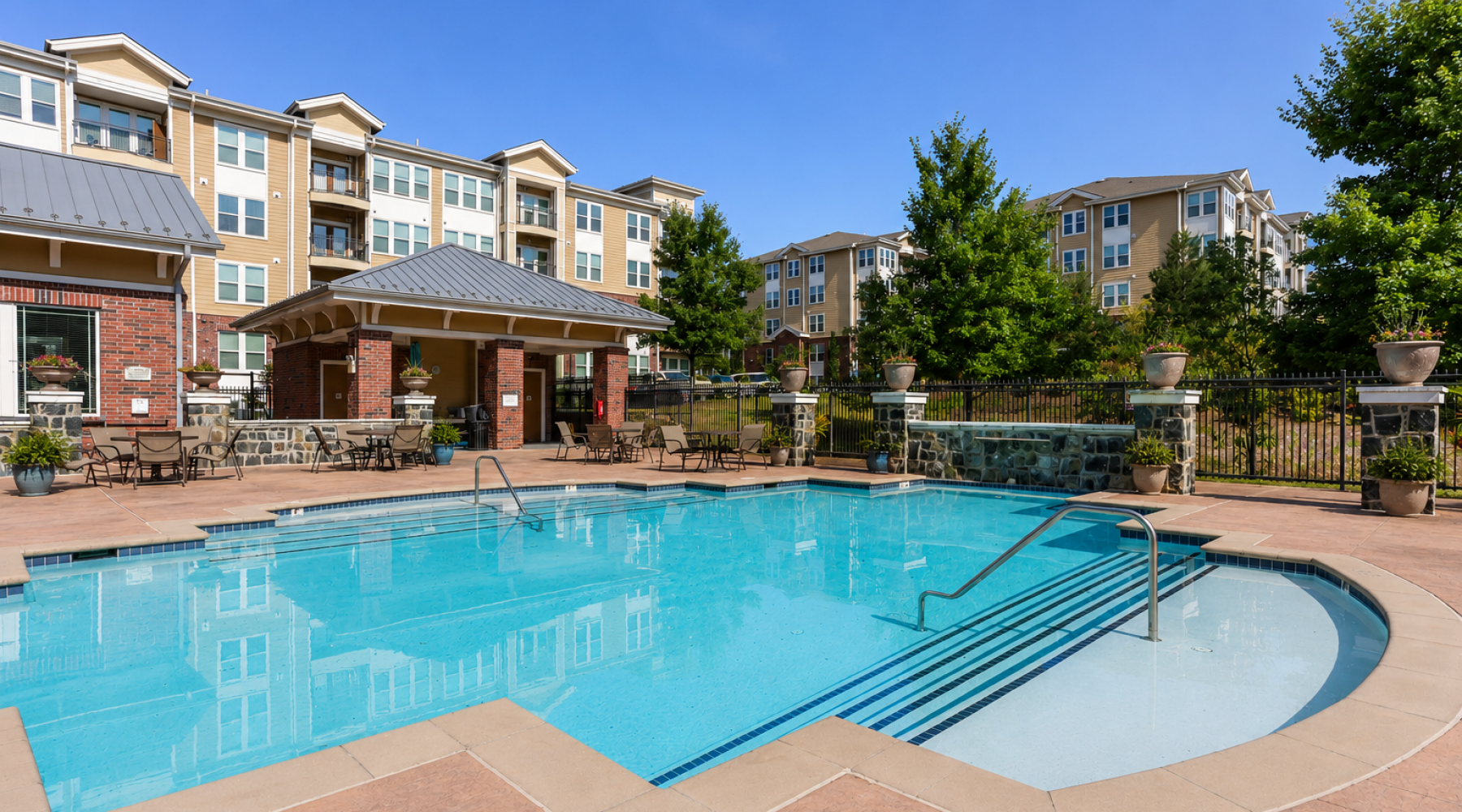 Resort-style pool and sundeck at Stone Pointe apartment community